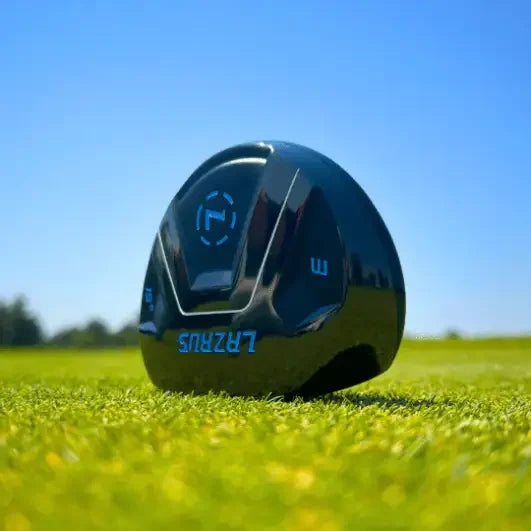 Lazrus black fairway wood golf club head resting on green grass under clear blue sky