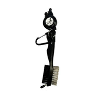 Black golf club cleaning brush with wire bristles, plastic handle, and attached Talon tag