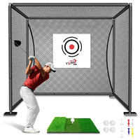 Man swinging golf club in black golf practice cage with green mat, golf balls, and tees