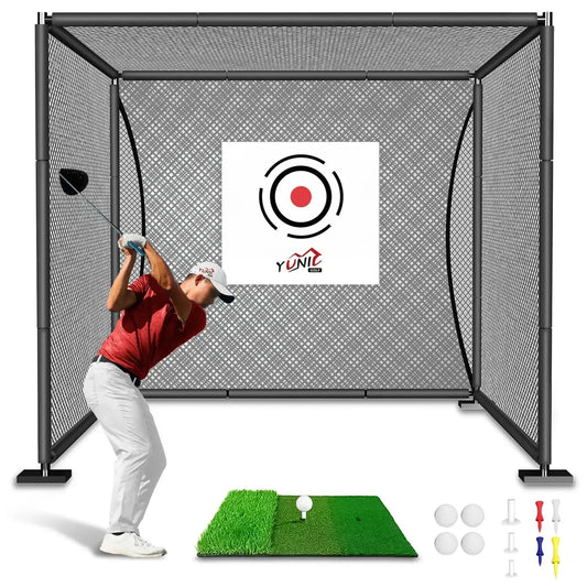 Man swinging golf club in black golf practice cage with green mat, golf balls, and tees