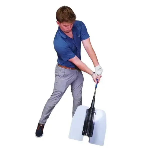 Man practicing golf swing using a golf power swing trainer with white resistance wings