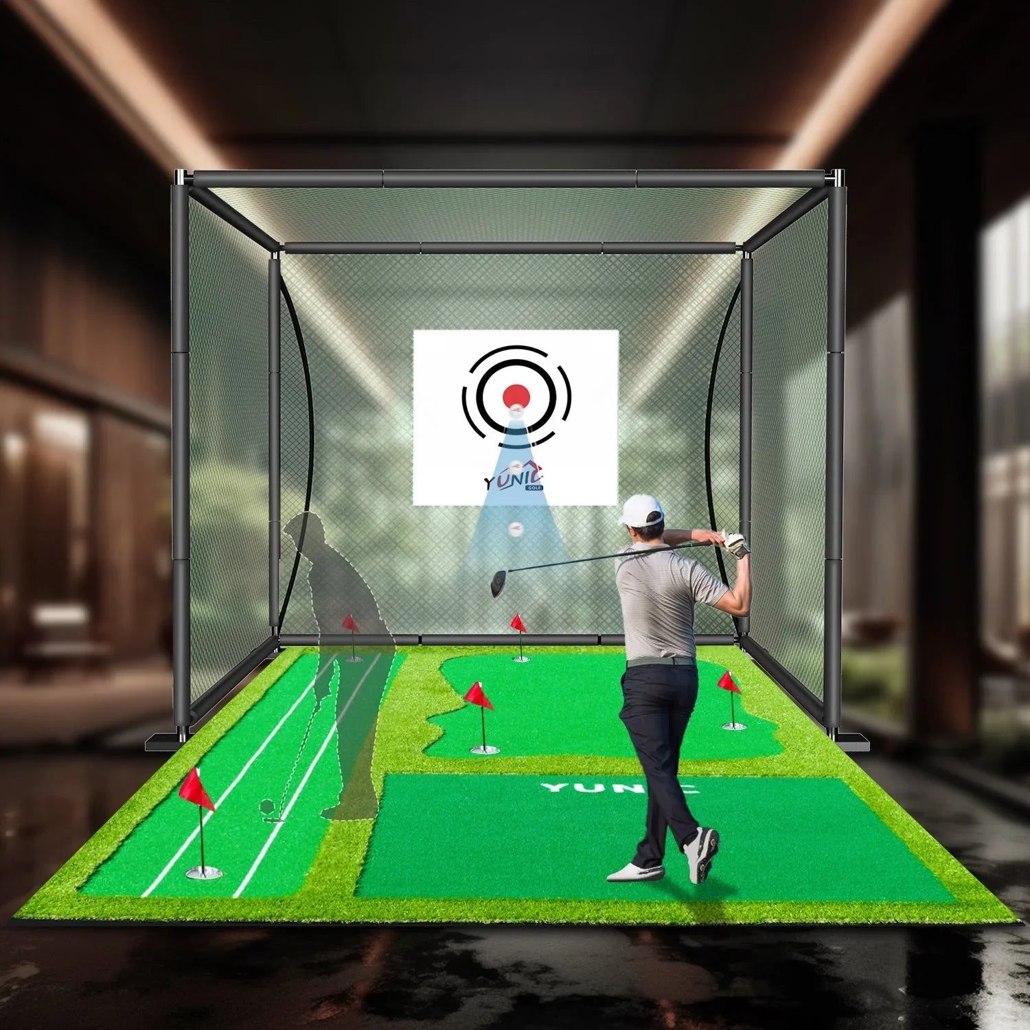 Golfer swinging club inside an indoor golf simulator with green putting mats and target screen