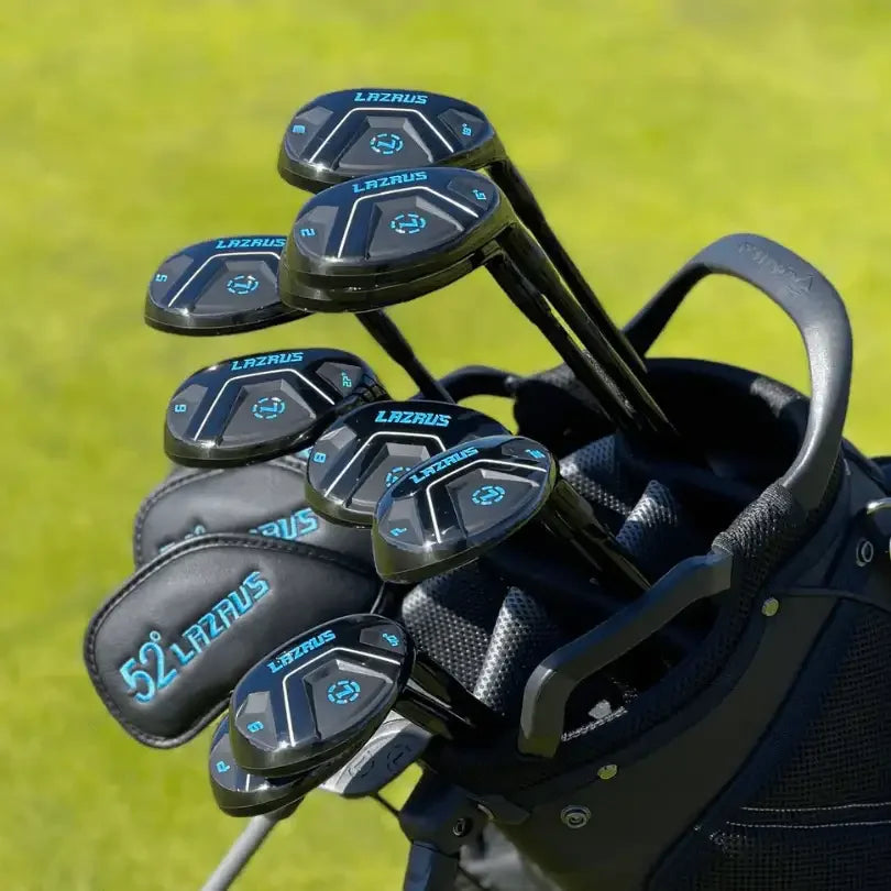 Set of Lazrus black golf hybrids and irons in a black golf bag on green grass