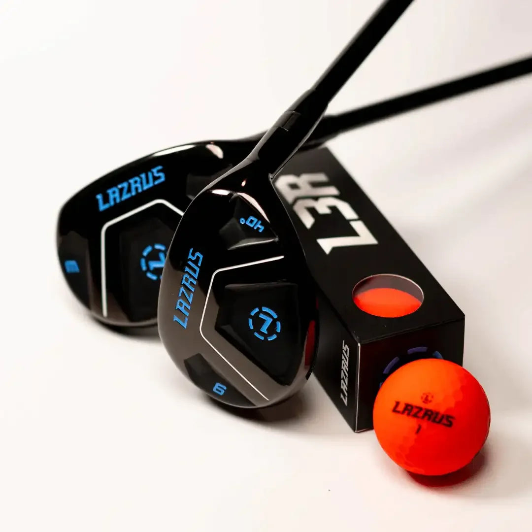 Black Lazrus golf clubs with blue details and an orange Lazrus golf ball on white background