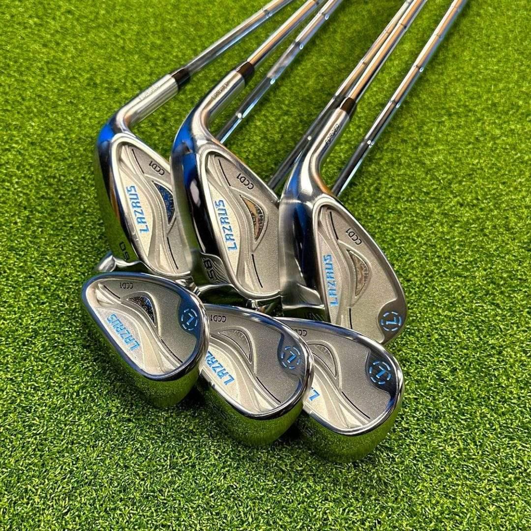Set of Lazrus golf cavity back wedges with chrome finish on green turf