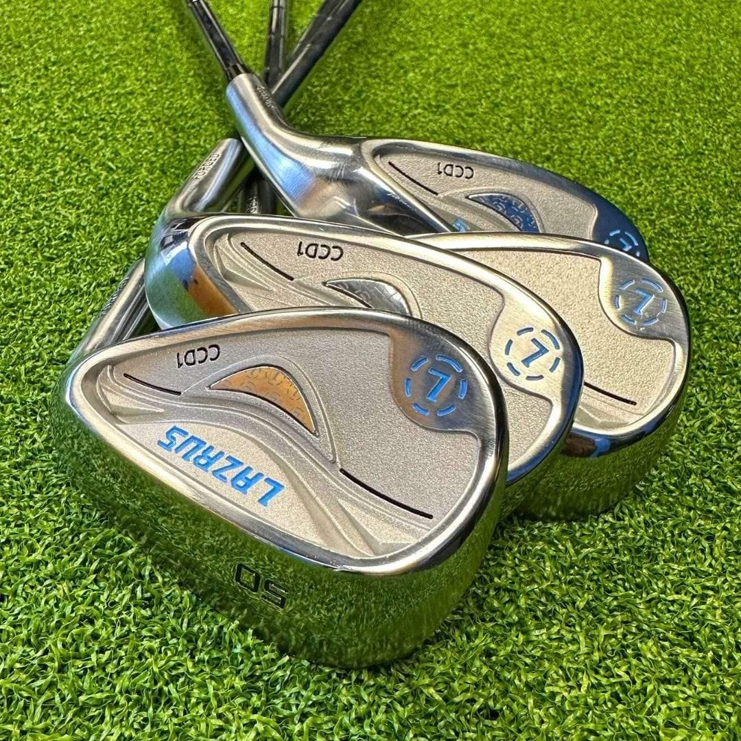 Set of Lazrus forged golf cavity back wedges with chrome finish on green turf