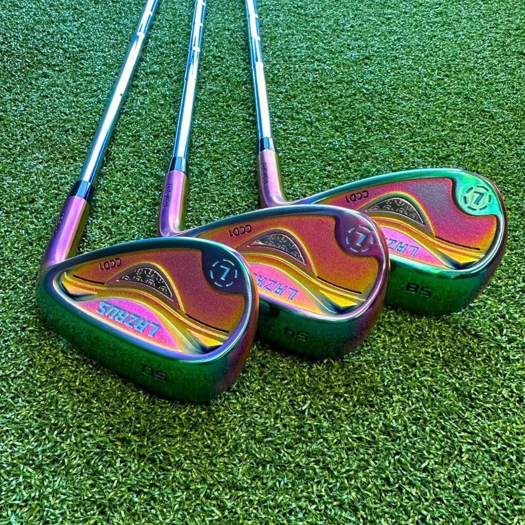 Three iridescent Lazrus forged golf wedges on green turf with 50, 54, 58 lofts
