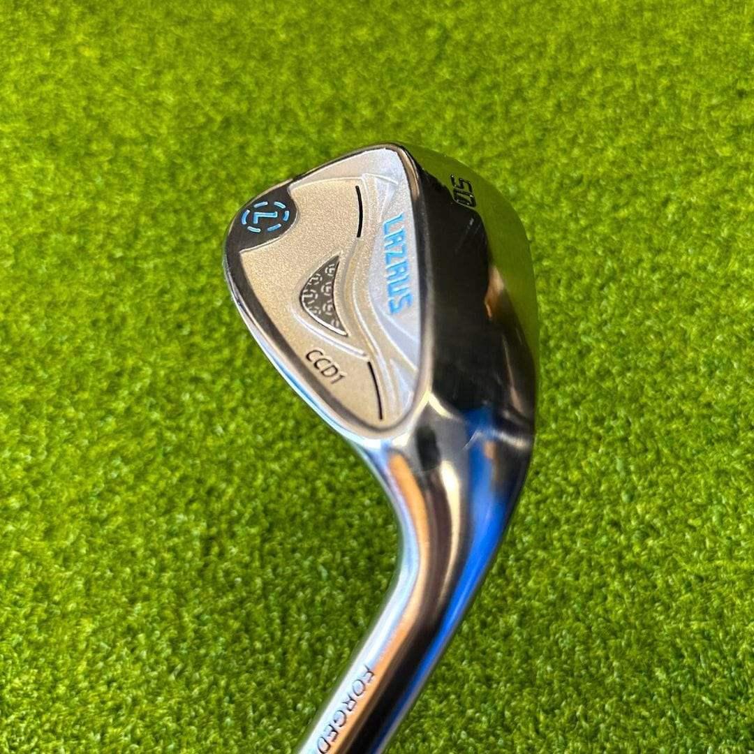 Lazrus golf cavity back wedge angled on green turf with polished steel and forged branding
