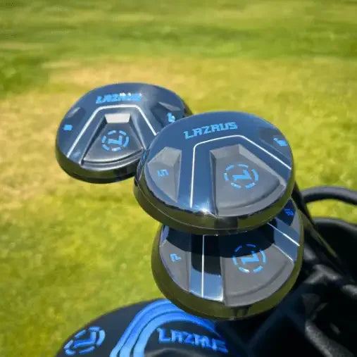 Close-up of Lazrus golf fairway woods with blue branding, displayed on grass outdoors