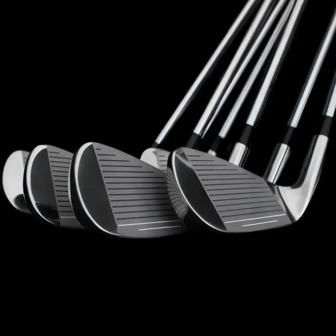 Set of polished golf iron clubs with clean grooves in a black background