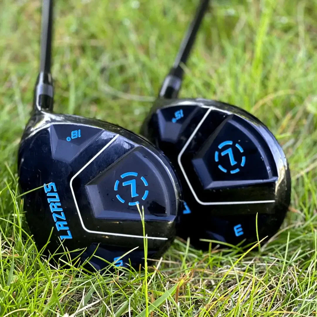Two Lazrus adjustable golf clubs, a driver and fairway wood, resting on green grass