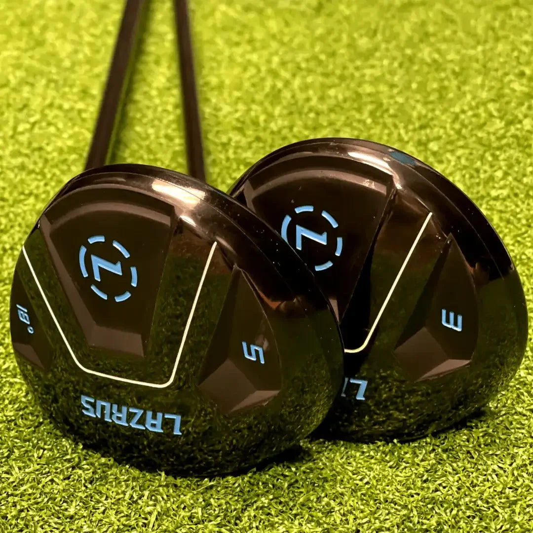 Close-up of Lazrus adjustable golf driver and fairway wood clubs with black heads and blue logos on green turf