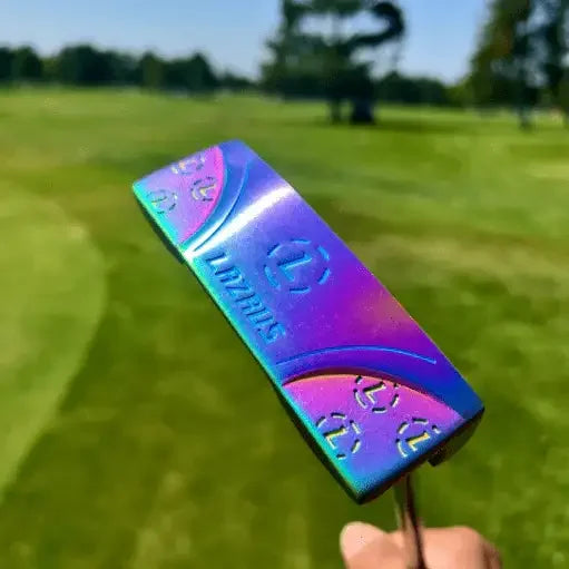Lazrus golf putter with a vibrant, multicolor milled face held over a green golf course