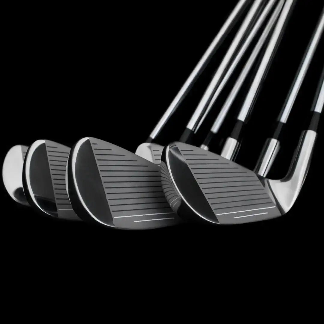 Set of six polished golf wedge irons with grooves on clubfaces against black background