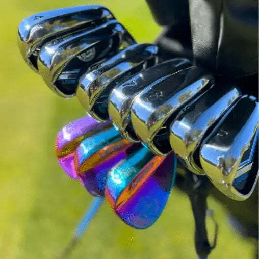 Set of Lazrus golf irons and colorful wedge clubs in black golf bag on grassy course
