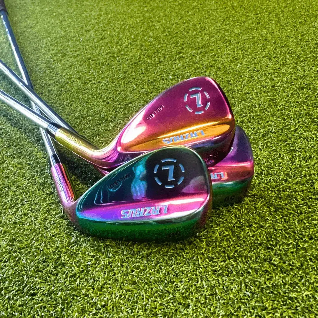 Three vibrant Lazrus Forged golf wedges with rainbow finish on green turf