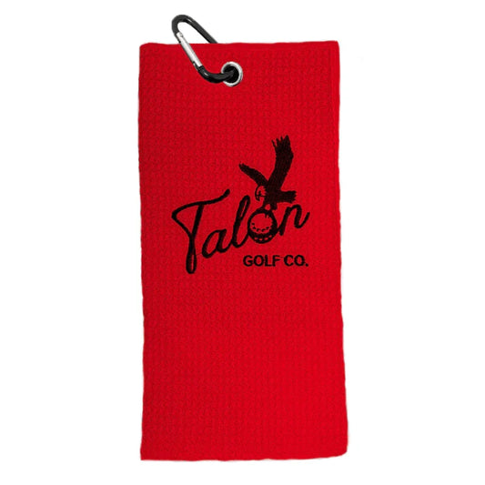 Red waffle golf towel with black Talon Golf Co. logo and attached carabiner clip