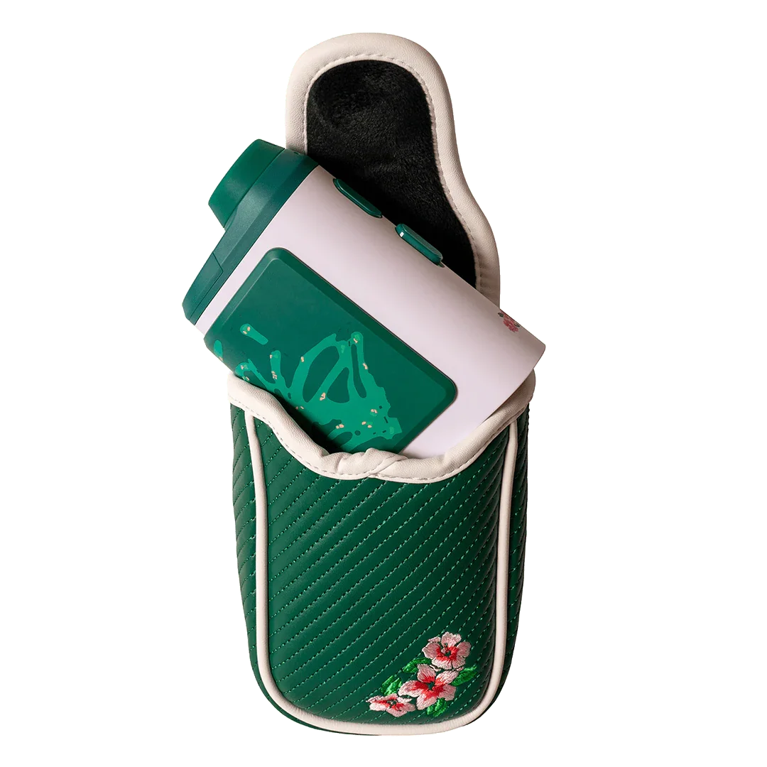 Green quilted soft shell rangefinder case with pink floral embroidery holding a white and green rangefinder