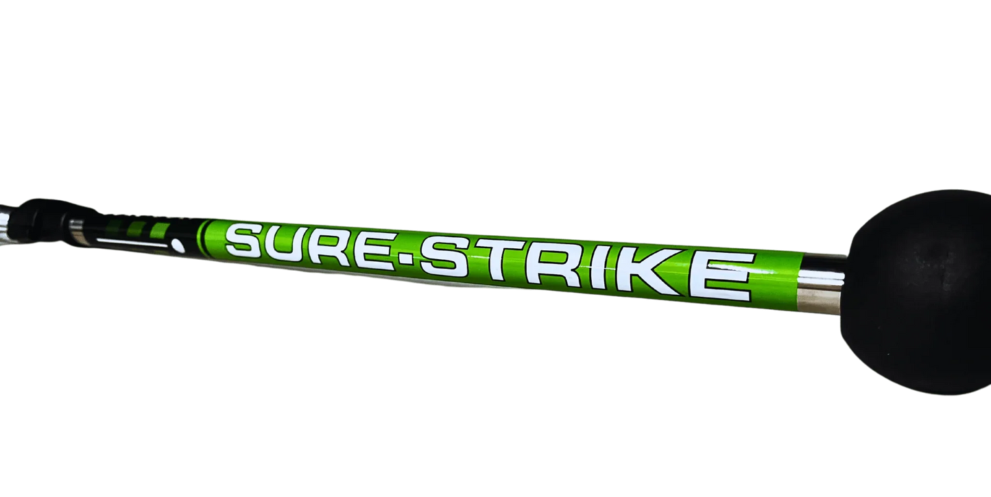Sure-Strike green and black golf training aid with foam ball on end, designed for swing practice