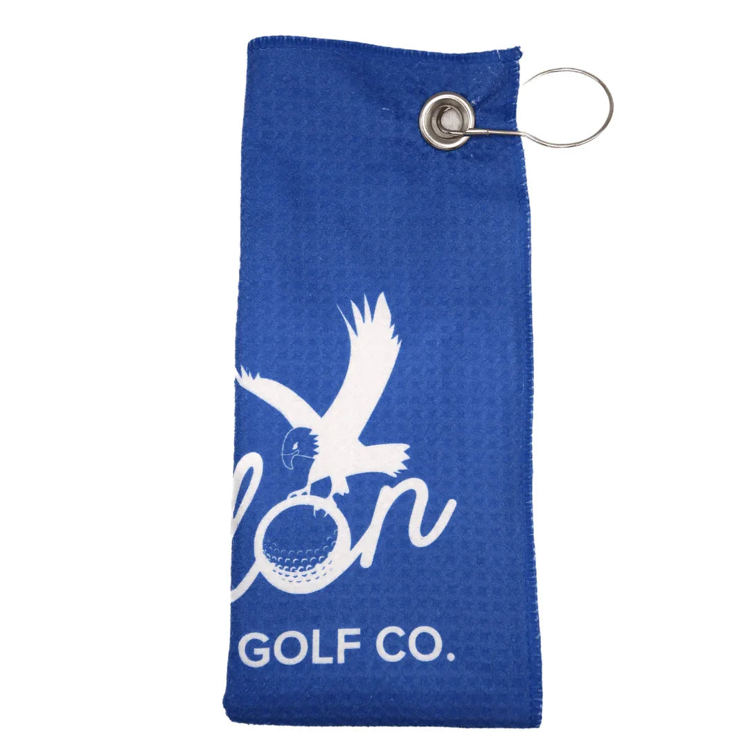 Blue Talon golf towel with white eagle and golf ball logo, metal clip attachment