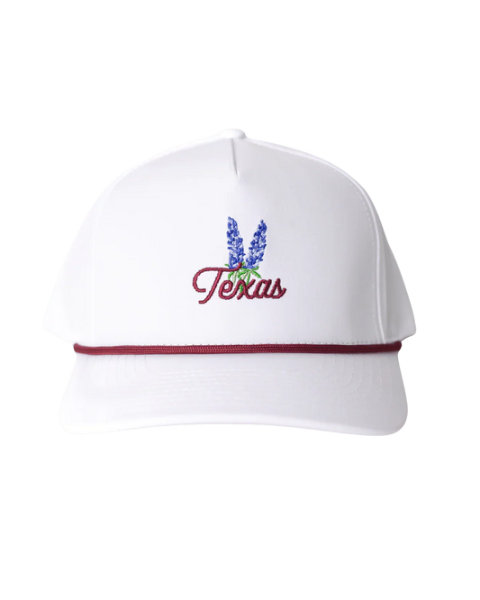 White baseball cap with Texas script, bluebonnet flower embroidery, and maroon rope detail