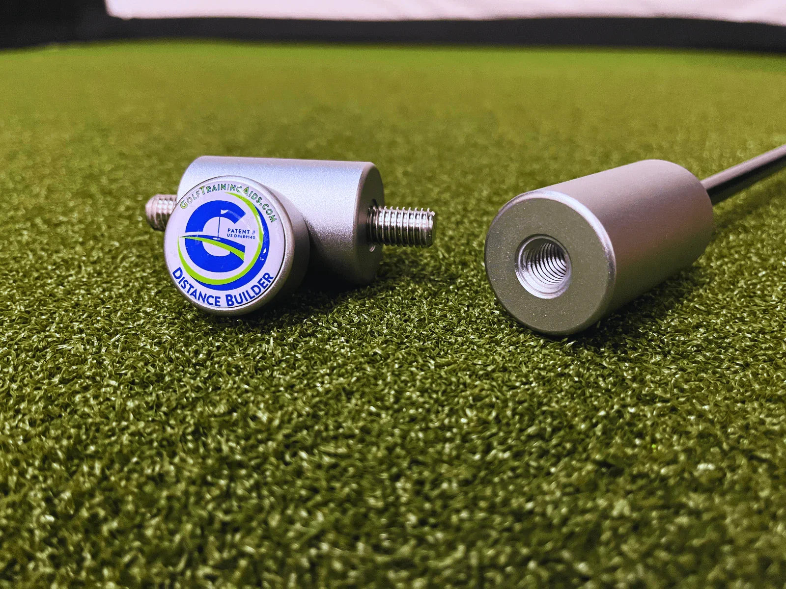 Golf training aid Distance Builder device parts on green turf for swing practice